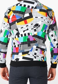 Buntes Sweatshirt mit geometrischen Mustern in Gelb, Grün, Blau, Pink und Schwarz auf einem grauen Hintergrund. Schwarze Rippbündchen und Saum.