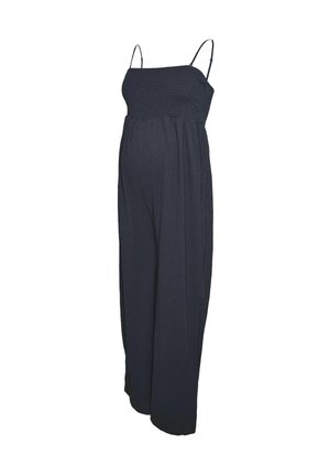 Combinaison de maternité en marine foncé, fabriquée en tissu léger. Dotée d'un corsage smocké, de fines bretelles et de jambes larges et fluides.