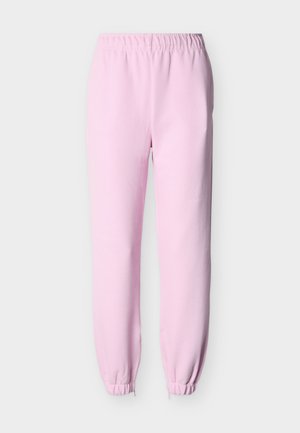 Ανοιχτό ροζ φόρμες με ελαστική μέση και μανσέτες στους αστραγάλους, παρουσιασμένες πάνω σε ένα απλό φωτεινό φόντο.