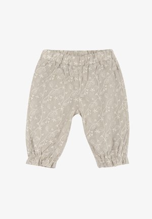 Jasnoszare spodnie z materiału z wzorem białych liści i jagód na całej powierzchni. Elastyczny pas i zgromadzone mankiety przy kostkach.