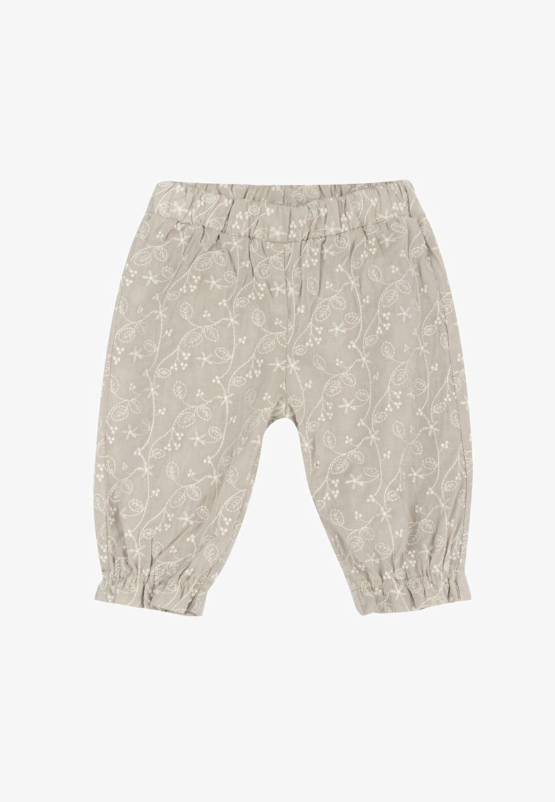 Pantalons en tissu gris clair avec un motif de feuilles et de baies blanches sur l'ensemble. Taille élastique et poignets froncés aux chevilles.