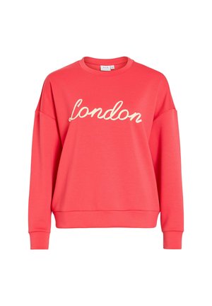 Sweat-shirt à manches longues rose corail avec le texte "London" en cursive blanche sur la poitrine, col rond, poignets et ourlet côtelés.