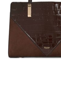 Brown leather handbag featuring a glossy, crocodile texture on the front, a smooth suede base, and gold hardware accents with branding.