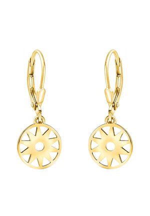 Boucles d'oreilles créoles en or avec pendentifs ronds à motif soleil comportant des découpes triangulaires et un petit trou central.
