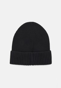 Black knitted beanie with a folded ribbed cuff. The texture is smooth with vertical knit patterns on the main body. Classic winter accessory.
