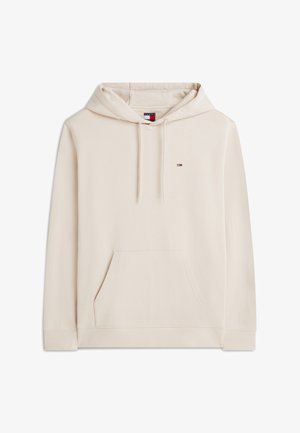 Béžová mikina s kapucňou, predným vreckom, nastaviteľnou šnúrkou na kapucni, rebrovanými manžetami a lemom, a malým logom Tommy Hilfiger na hrudi.