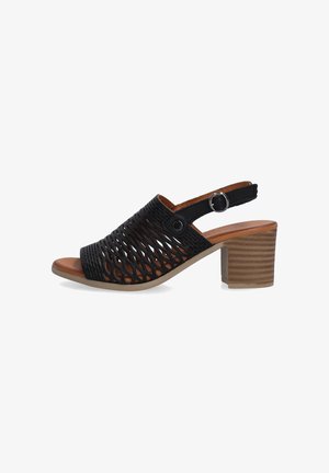 Black open-toe slingback shoe with a geometric mesh design, medium block heel, and leather accents, featuring a buckle closure.