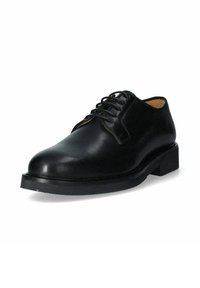 Scarpa oxford in pelle nera con punta arrotondata, design con lacci e suola in gomma spessa. Texture liscia con dettagli di cucitura minimi.