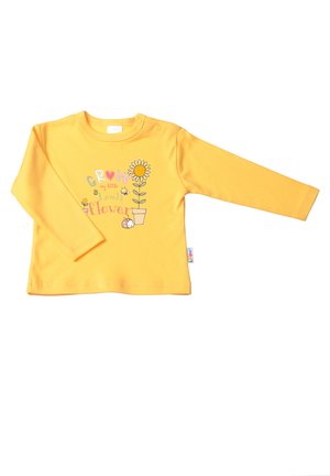 Yellow long-sleeve shirt made of soft cotton, featuring a colorful print of a flower pot with the text "Grow my little lovely flower."