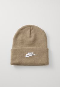 Barna kötött sapka hajtott széllel, elöl fehér hímzett Nike logóval. Puha tapintás és rugalmas illeszkedés.