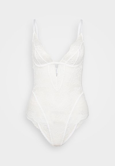 White lace bodysuit with a deep V-neckline, thin straps, floral pattern, and sheer texture; features a keyhole detail at the front.