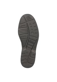 Sole di scarpa in gomma nera con motivi testurizzati, tra cui scanalature e design esagonali per la trazione. Profilo arrotondato e piatto.