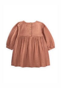 Langärmliges, blassrosa Kleid aus strukturiertem Baumwollstoff. Hat eine geraffte Taille und drei Holzknöpfe hinten.