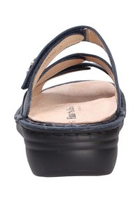 Navy leather sandal with multiple straps, a textured insole, and a cushioned black platform sole. Features a subtle decorative accent.