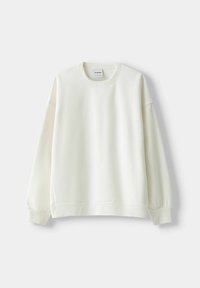 Felpa girocollo in cotone color avorio, con maniche lunghe e polsini a coste, orlo a coste, texture liscia e design semplice.