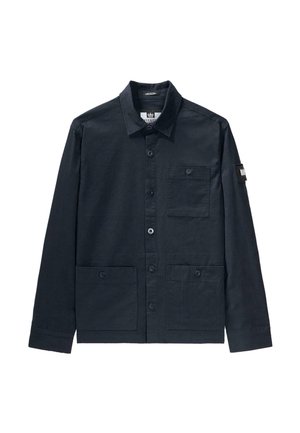 Navy blue, button-up shirt jacket made of cotton. Features two front pockets and a patch on the upper sleeve. Classic collar design.