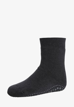Dark grey ankle sock with ribbed texture, cuffed top, and rubber grip dots on the underside for traction. Simple, functional design.
