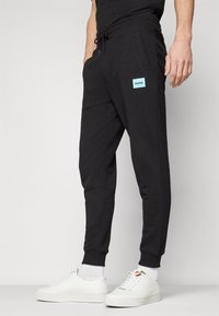 HUGO DOAK - Pantaloni de trening - black