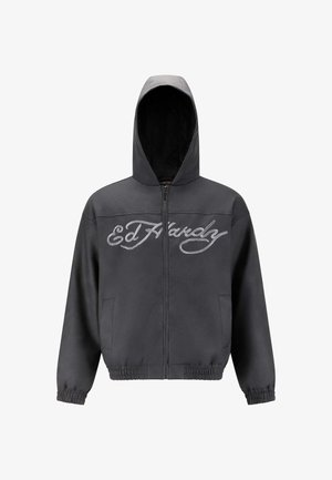 Black zip-up hoodie with "Ed Hardy" logo across the chest, elastic cuffs and hem, and side pockets, shown on a white background.