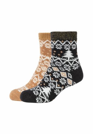 Calze lavorate a maglia: una in marrone chiaro con motivi bianchi, l'altra in nero con design geometrici bianchi e arancioni e un motivo ad albero.