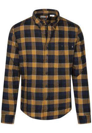 Chemise en flanelle à carreaux bleu marine, jaune et marron. Design à boutons avec un col et une poche poitrine unique. Texture douce avec une coupe régulière.