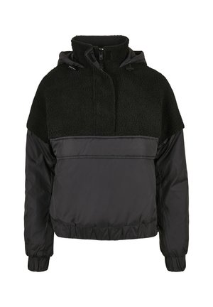 Chaqueta negra con una sección superior de forro polar texturizado, sección inferior lisa y cuello alto con cordones ajustables.