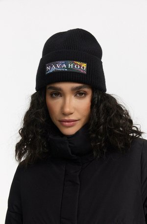 Black knitted beanie featuring a colorful "Nava Hoo" logo patch. The design is ribbed with a snug fit, suitable for cold weather.