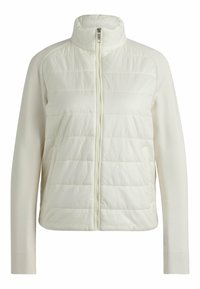 Giacca leggera in crema con parte frontale trapuntata e lati in tessuto liscio. Presenta un colletto alto, zip completa e due tasche laterali.