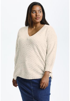 Beige gebreide trui met een V-hals, textuurpatroon en veelkleurige vlekken. Heeft lange mouwen en een ontspannen pasvorm.