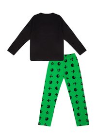 Black long-sleeve shirt paired with green pants featuring black geometric patterns. The shirt has a smooth texture; the pants are lightweight cotton.