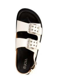 Sandale blanche avec deux brides à boucles réglables et une semelle intérieure noire rembourrée, taille 39, vue de dessus.