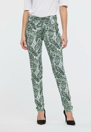 Pantalons à motifs avec un design abstrait vert et noir. Coupe slim, taille mi-haute, tissu au toucher doux.