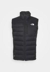 Černá bezrukávová péřová vesta značky North Face s předním zipem, kapsou na zip na hrudi a vysokým límcem na jednobarevném pozadí.