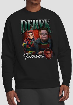 Person wearing black sweatshirt featuring three images of a boy with glasses and striped sweater, with "Derek Turnbow" text above and below.
