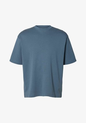 T-shirt di cotone blu con collo rotondo, maniche corte e vestibilità rilassata. Il tessuto ha una consistenza liscia ed è privo di motivi o decorazioni.