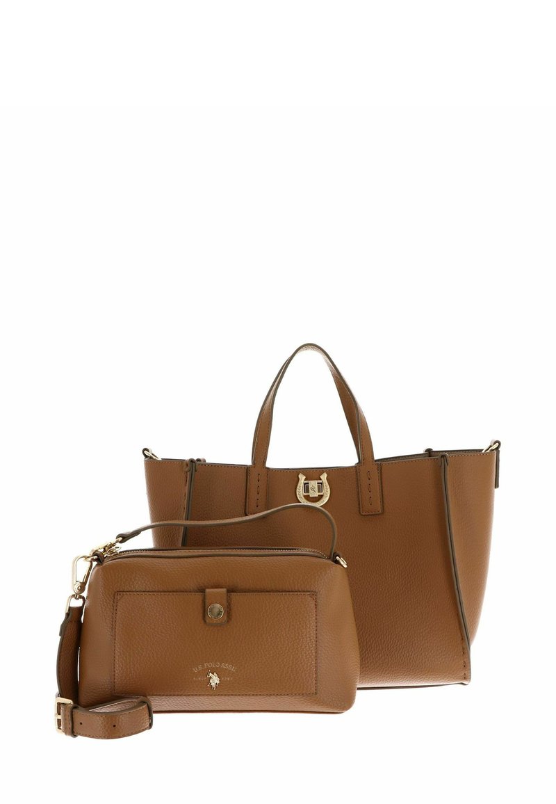 Sac cabas en cuir marron avec poignées courtes et accent de logo, accompagné d'une petite pochette zippée de design et couleur similaires.