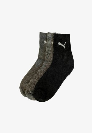 Three pairs of ankle-height socks in dark gray, light gray, and black. All feature a ribbed cuff and a small white logo. Made of textured fabric.