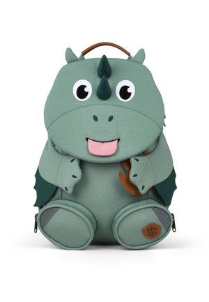 Green children's backpack shaped like a smiling dragon with wings, horns, large eyes, and two front zippered pockets.