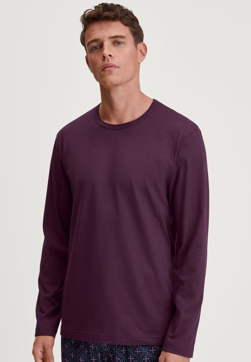 Langarmshirt van dieppaarse stof, met een ronde halslijn en een gladde textuur, ontworpen voor casual gebruik.