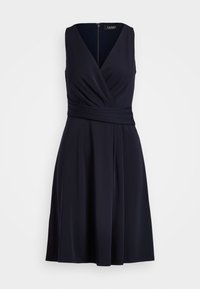 Navy sleeveless dress with a V-neck, twisted front detail, fitted waist, and flared skirt. Made of smooth, stretchy fabric with a zip back.