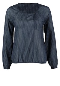 Tmavě modrá blůza s dlouhými rukávy z lehkého materiálu s bílými puntíky, kulatým výstřihem a staženým spodním lemem pro volnější střih.