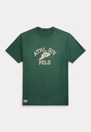 Green cotton t-shirt with a round neckline, short sleeves, and a printed graphic featuring "ATHL.DIV. 67" and "POLO" in beige.