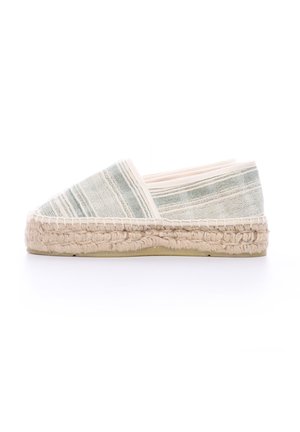 Espadrilla in tela con un design a strisce bianche e azzurre, suola in juta naturale e punta rotonda. Tessuto leggero e traspirante.