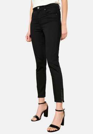 Jean skinny noirs au design ajusté, avec des zips aux chevilles, des poches avant et des passants de ceinture, fabriqué dans un mélange de coton extensible.