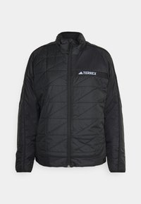 Giacca nera trapuntata con colletto alto, dotata di una zip integrale e logo. Realizzata in un materiale liscio e leggero con un design strutturato.