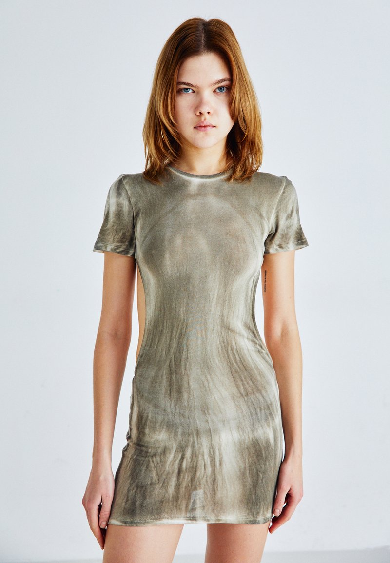 Short-sleeved, olive-green dress made of soft, sheer fabric with a fitted design and side cut-outs, featuring a textured, wavy pattern.