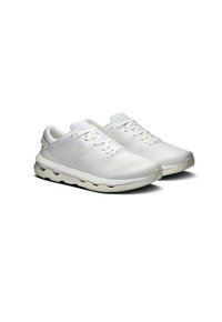 White athletic shoes with a smooth upper, laces, and a cushioned sole featuring distinct cutouts for ventilation and flexibility.
