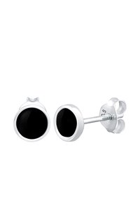 Pendientes de plata con centros circulares negros, superficie lisa y un diseño sencillo. Incluyen un cierre a presión y respaldo tipo mariposa.