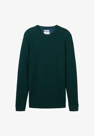 Pull en tricot vert foncé avec des manches longues, col rond, texture côtelée et ourlet droit. Étiquette visible dans la zone du col.