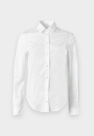 Witte blouse met lange mouwen gemaakt van katoen, met een puntige kraag, knoopsluiting aan de voorkant met gele knopen en een subtiele geborduurde logo op de borst.